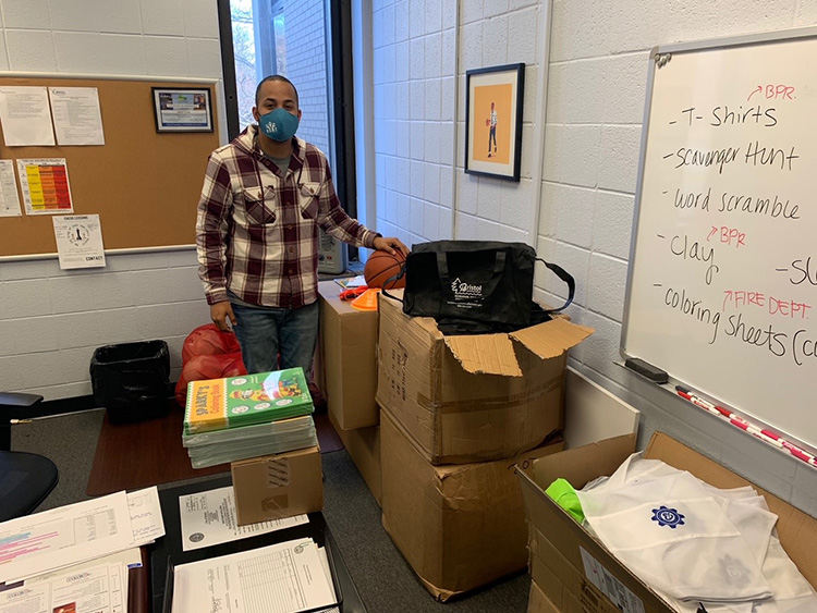 Amry Shelby, Recreation Supervisor at BPRYS, organizing and packing All-Heart Park Packs. Photo courtesy of BPRYS. Amry Shelby, Recreation Supervisor at BPRYS, organizing and packing All-Heart Park Packs. Photo courtesy of BPRYS.