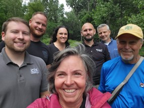 BNRLT staff take a selfie with community members and local Bobcat staff.