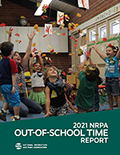 2021 Out-of-School Time Report Cover Cover of the 2021 Out-of-School Time Report with a group of children throwing leaves in the air.