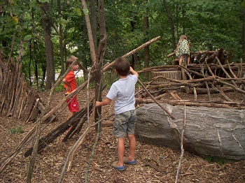Blog-Nature-Play-Guidelines-Children-Constructing-with-Sticks-in-Woods Blog-Nature-Play-Guidelines-Children-Constructing-with-Sticks-in-Woods