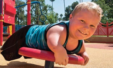 child playing on playground equipment child playing on playground equipment
