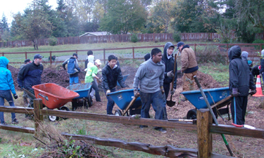Volunteers work through a heavy downpour at Green Kent Day. Volunteers work through a heavy downpour at Green Kent Day.