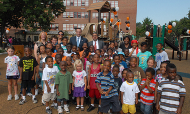Mayor Gray (in blue tie) and D.C. Parks Director Jesús Aguirre (in red tie) announce a playground renovation program. Mayor Gray (in blue tie) and D.C. Parks Director Jesús Aguirre (in red tie) announce a playground renovation program.