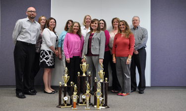 Slimmer NRPA staff members show off their hard-earned trophies. Slimmer NRPA staff members show off their hard-earned trophies.
