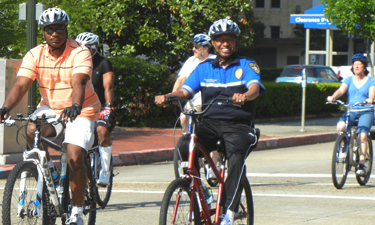 Mayor-President Holden (in blue) rides at the annual Mayor's Family Bike Ride through downtown Baton Rouge. Mayor-President Holden (in blue) rides at the annual Mayor's Family Bike Ride through downtown Baton Rouge.