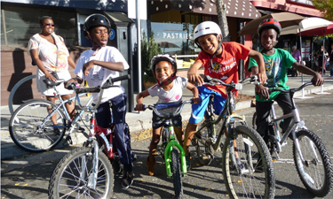Young cyclists enjoy a ciclovia event in Berkeley, California. Young cyclists enjoy a ciclovia event in Berkeley, California.