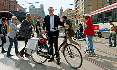 Gil Penalosa walks the walk — or, in this case, cycles it — using his bicycle to traverse Toronto’s busy, vibrant streets.  Gil Penalosa walks the walk — or, in this case, cycles it — using his bicycle to traverse Toronto’s busy, vibrant streets.