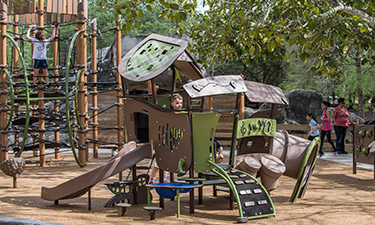 A man-made island is transformed into an outdoor play wonderland. A man-made island is transformed into an outdoor play wonderland.