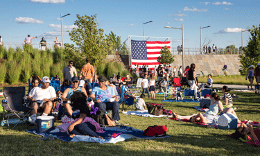 Visitors gather at Long Bridge Park to enjoy open space for picnicking and games. Visitors gather at Long Bridge Park to enjoy open space for picnicking and games.