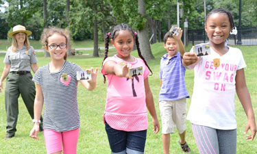 Fourth grade students from Samuel W. Tucker Elementary School in Alexandria, Virginia, show off their Every Kid in a Park passes. Fourth grade students from Samuel W. Tucker Elementary School in Alexandria, Virginia, show off their Every Kid in a Park passes.